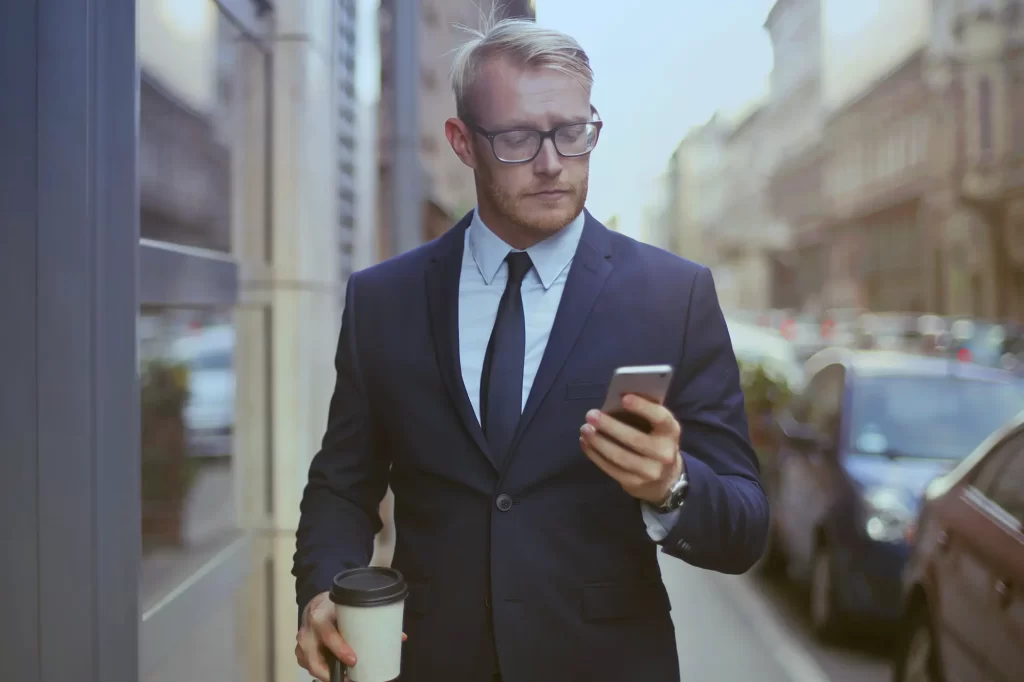 business man looking on his phone