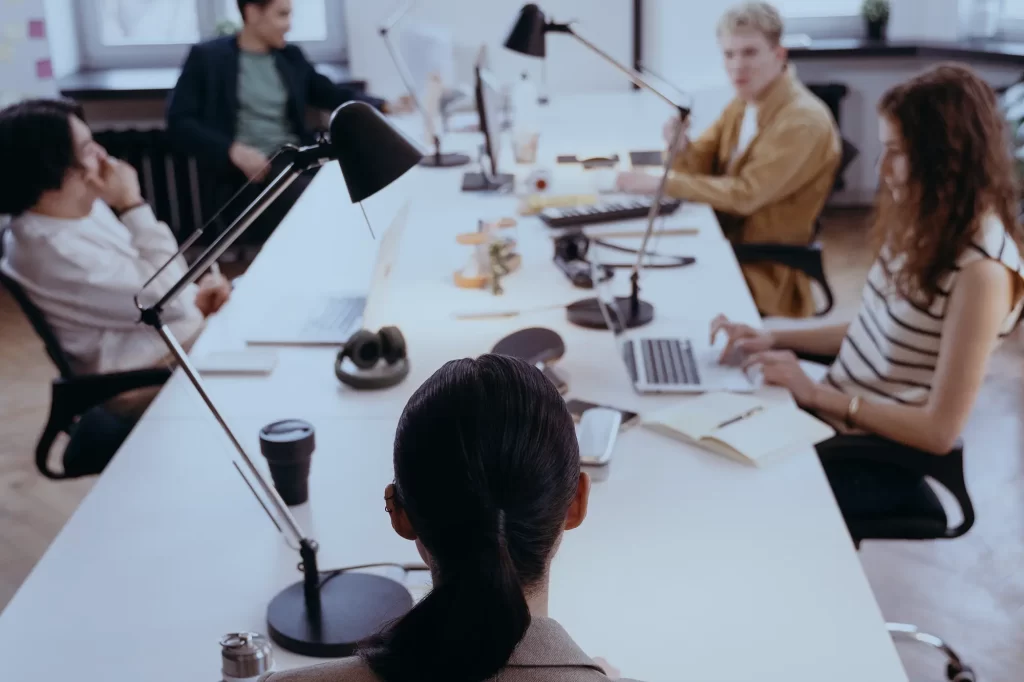 group of people having a discussion in a conference room